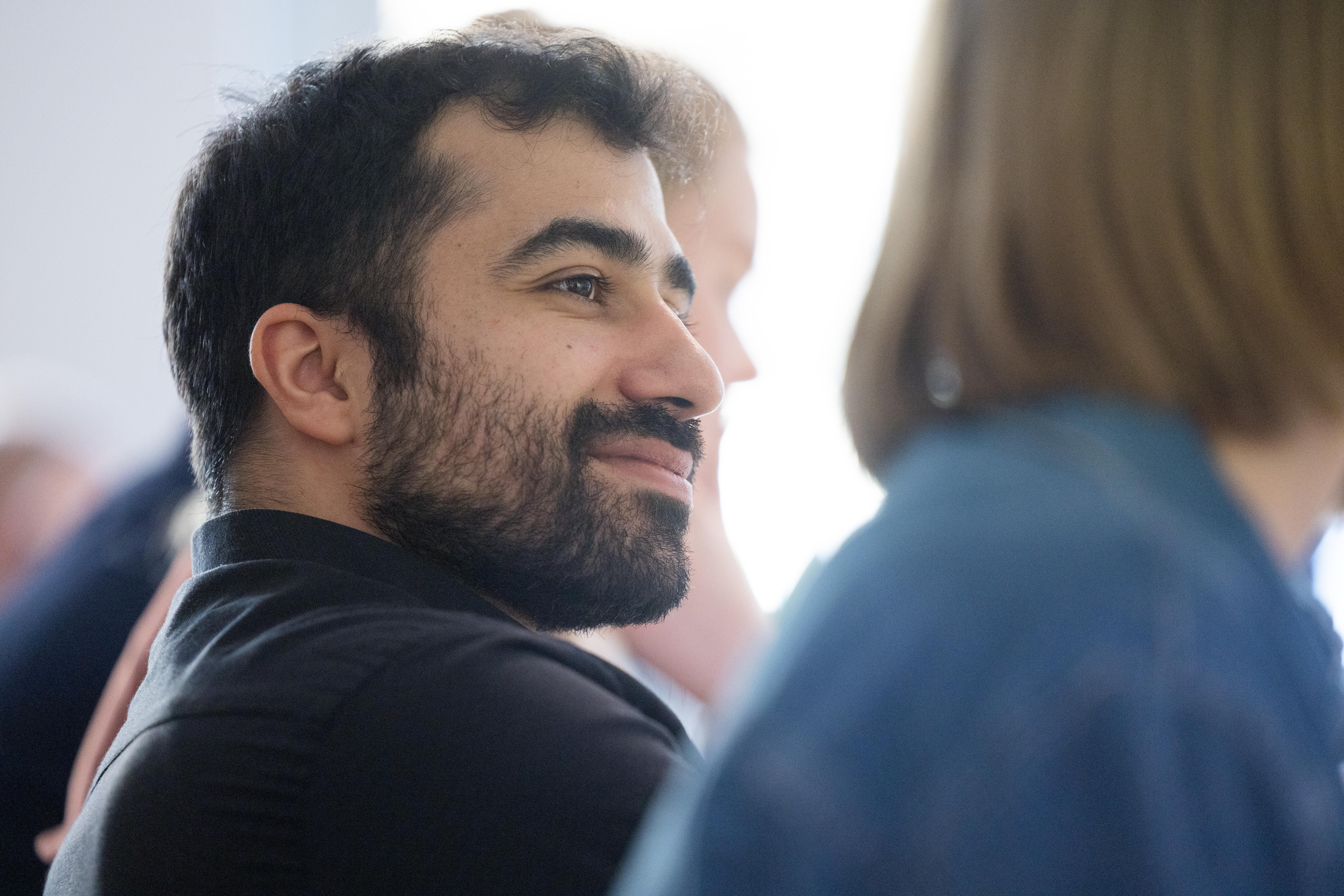 A man smiles